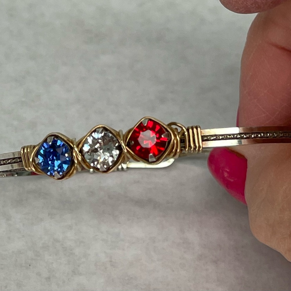 Custom Sterling and 14k Gold wire bracelet, with red, crystal and blue stones.